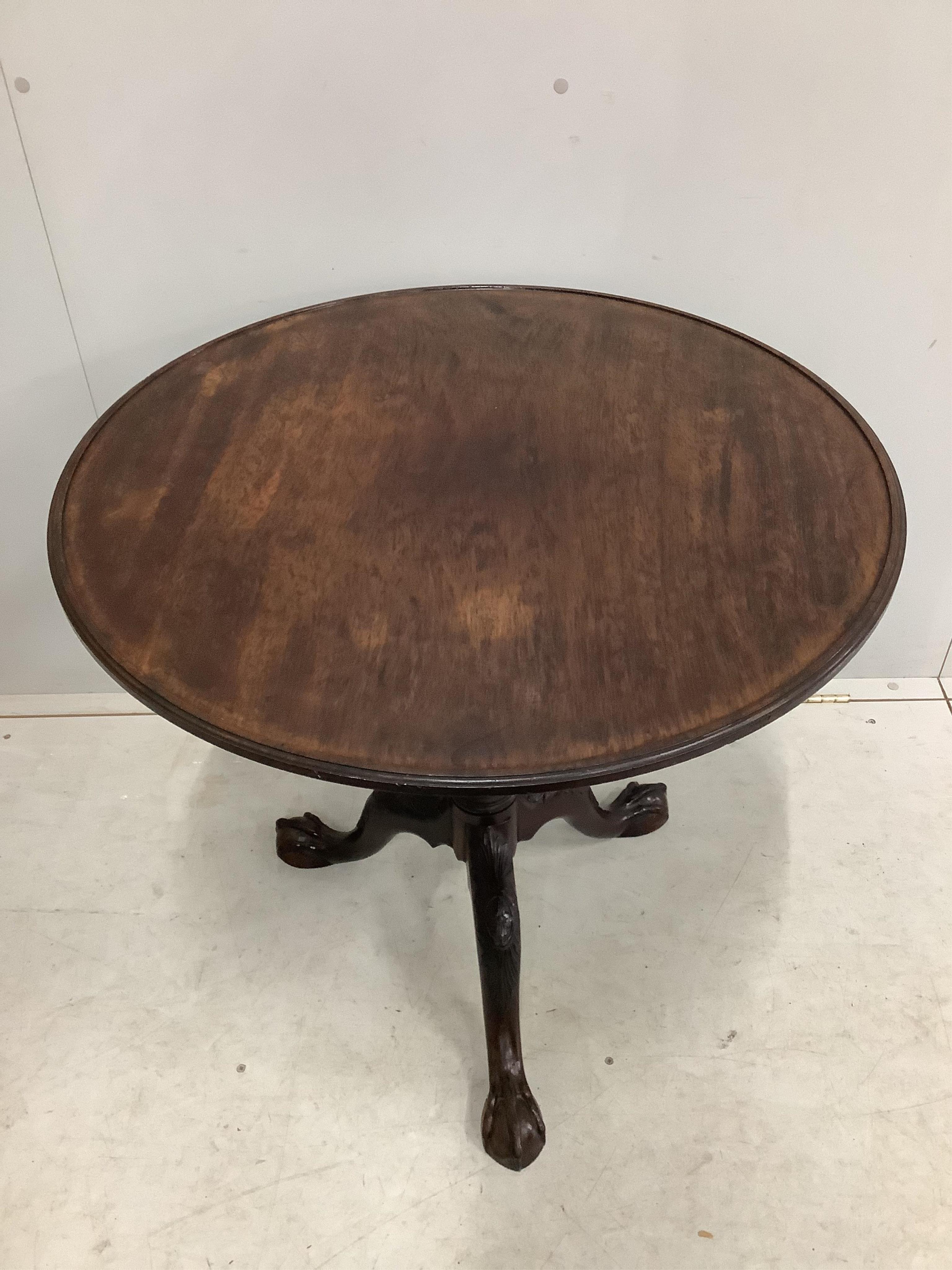 A George III circular mahogany tilt top birdcage tripod tea table, diameter 74cm, height 71cm. Condition - fair